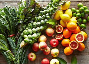 a group of fruits and vegetables on a wood surface Healthy Weight Loss Diets Coleshill